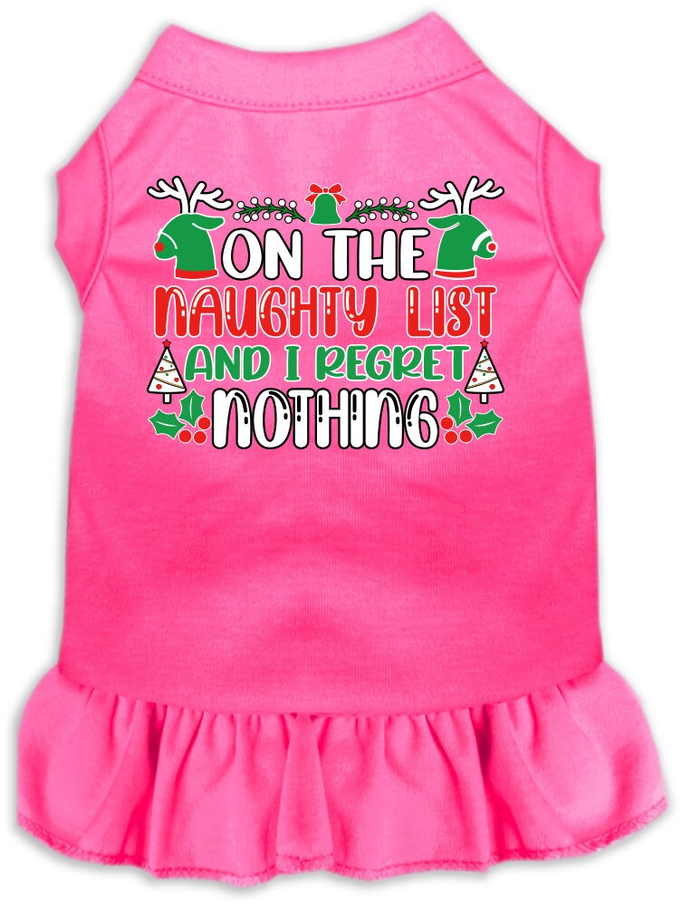 A festive Christmas dress for pets featuring the phrase 'On The Naughty List And I Regret Nothing', designed for dogs and cats with a ruffled bottom.