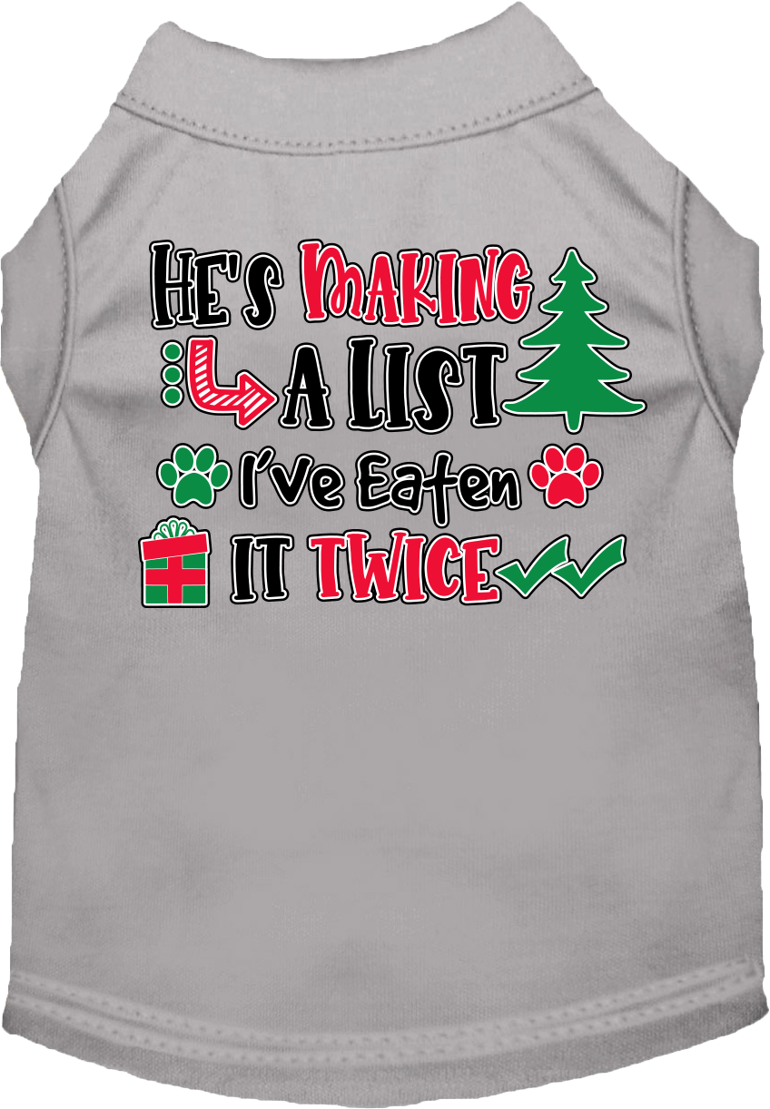 A festive Christmas shirt for dogs and cats, featuring the phrase 'He's Making A List, I've Eaten It Twice' in a playful design.