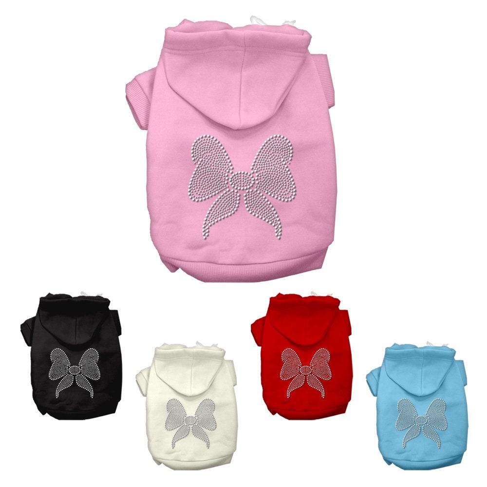 A festive Christmas hoodie for pets featuring a rhinestone bow, designed for dogs and cats, showcasing its soft fabric and stylish design.