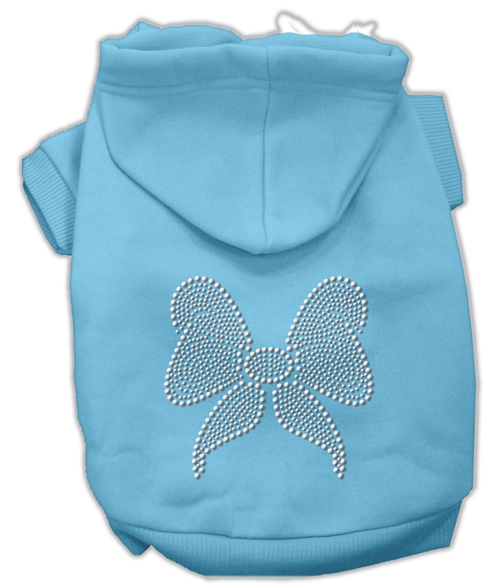 A festive Christmas hoodie for pets featuring a rhinestone bow, designed for dogs and cats, showcasing its soft fabric and stylish design.