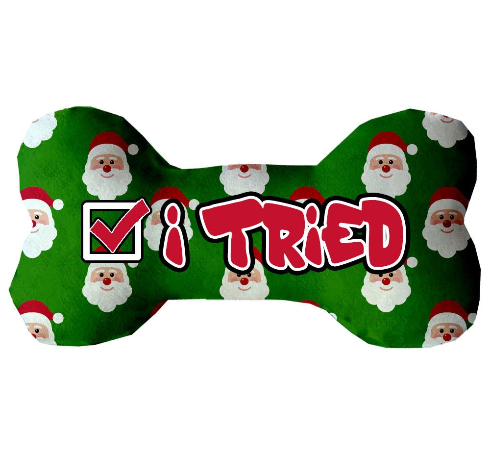 Christmas-themed plush bone toy for dogs with 'Naughty, Nice, or I Tried' design, available in three sizes, soft and cuddly.