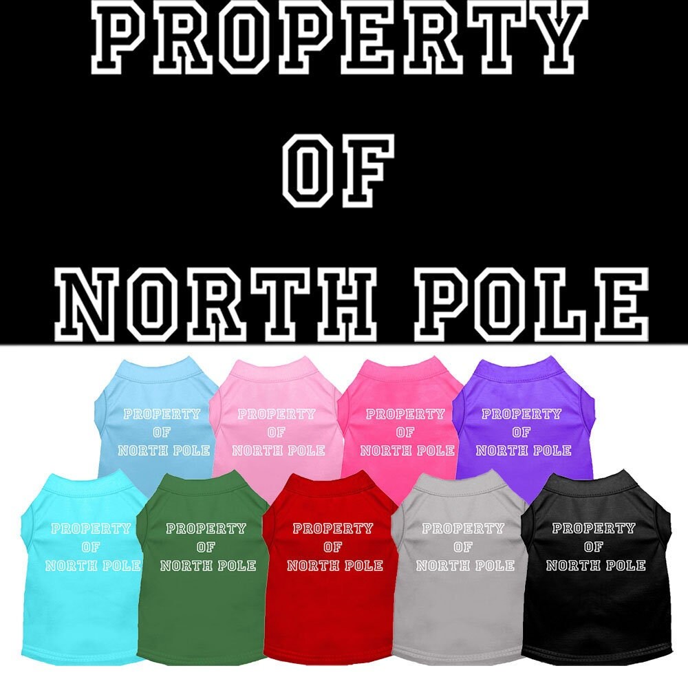 A festive Christmas dog shirt featuring the text 'Property Of North Pole', designed for comfort and durability, perfect for holiday celebrations.