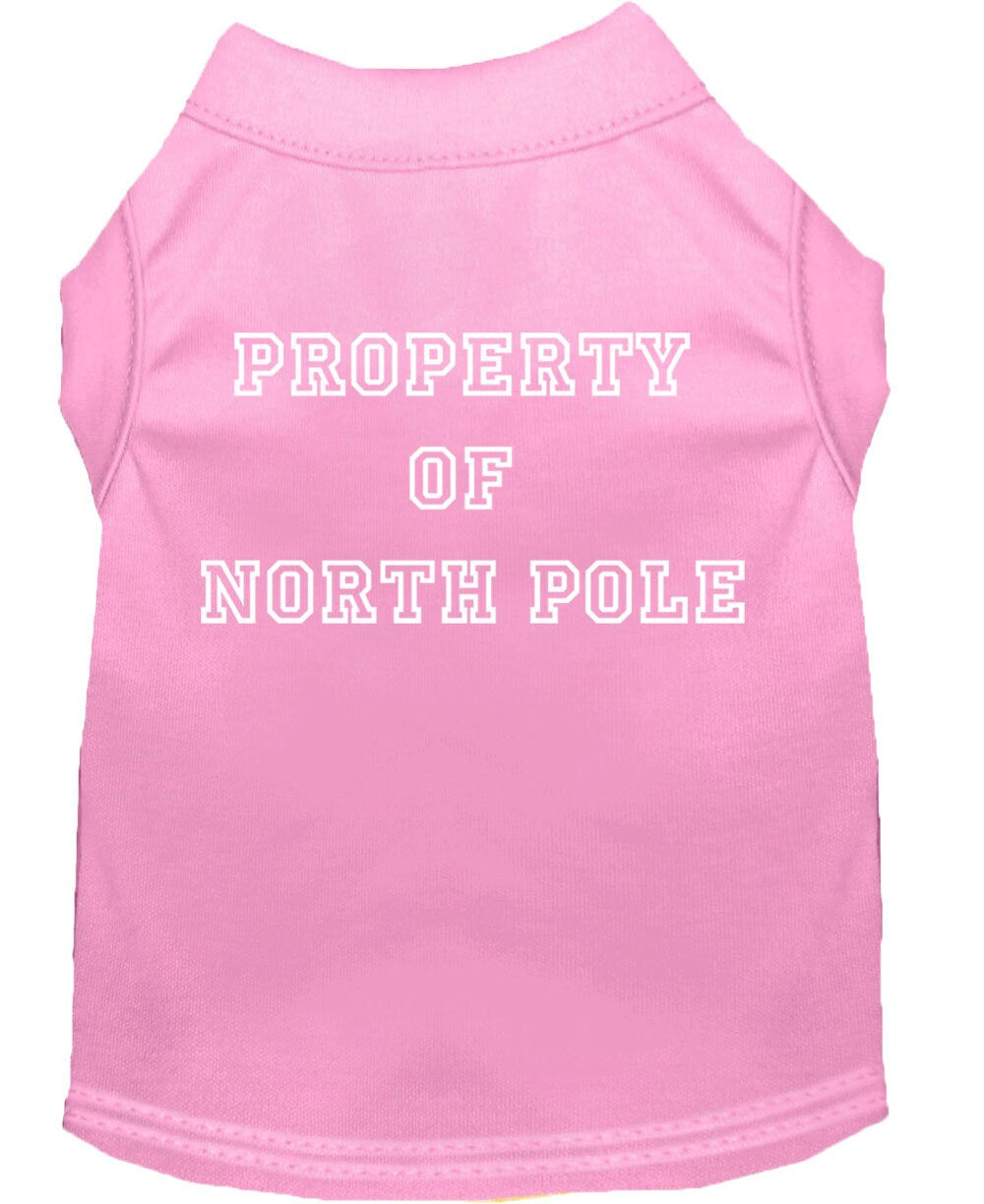 A festive Christmas dog shirt featuring the text 'Property Of North Pole', designed for comfort and durability, perfect for holiday celebrations.