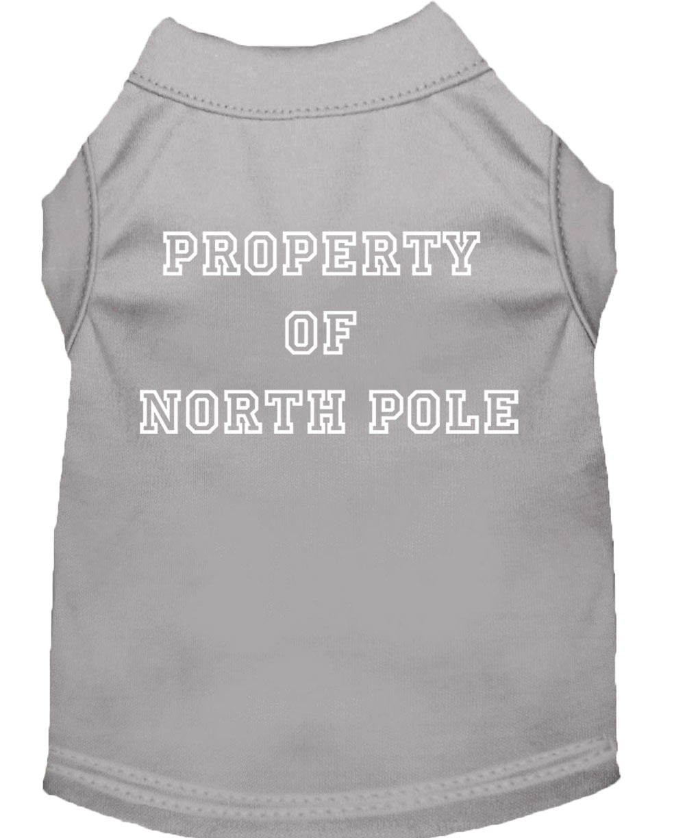 A festive Christmas dog shirt featuring the text 'Property Of North Pole', designed for comfort and durability, perfect for holiday celebrations.