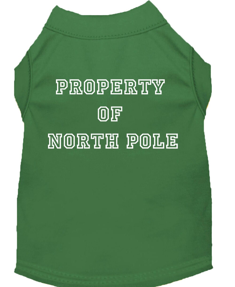 A festive Christmas dog shirt featuring the text 'Property Of North Pole', designed for comfort and durability, perfect for holiday celebrations.