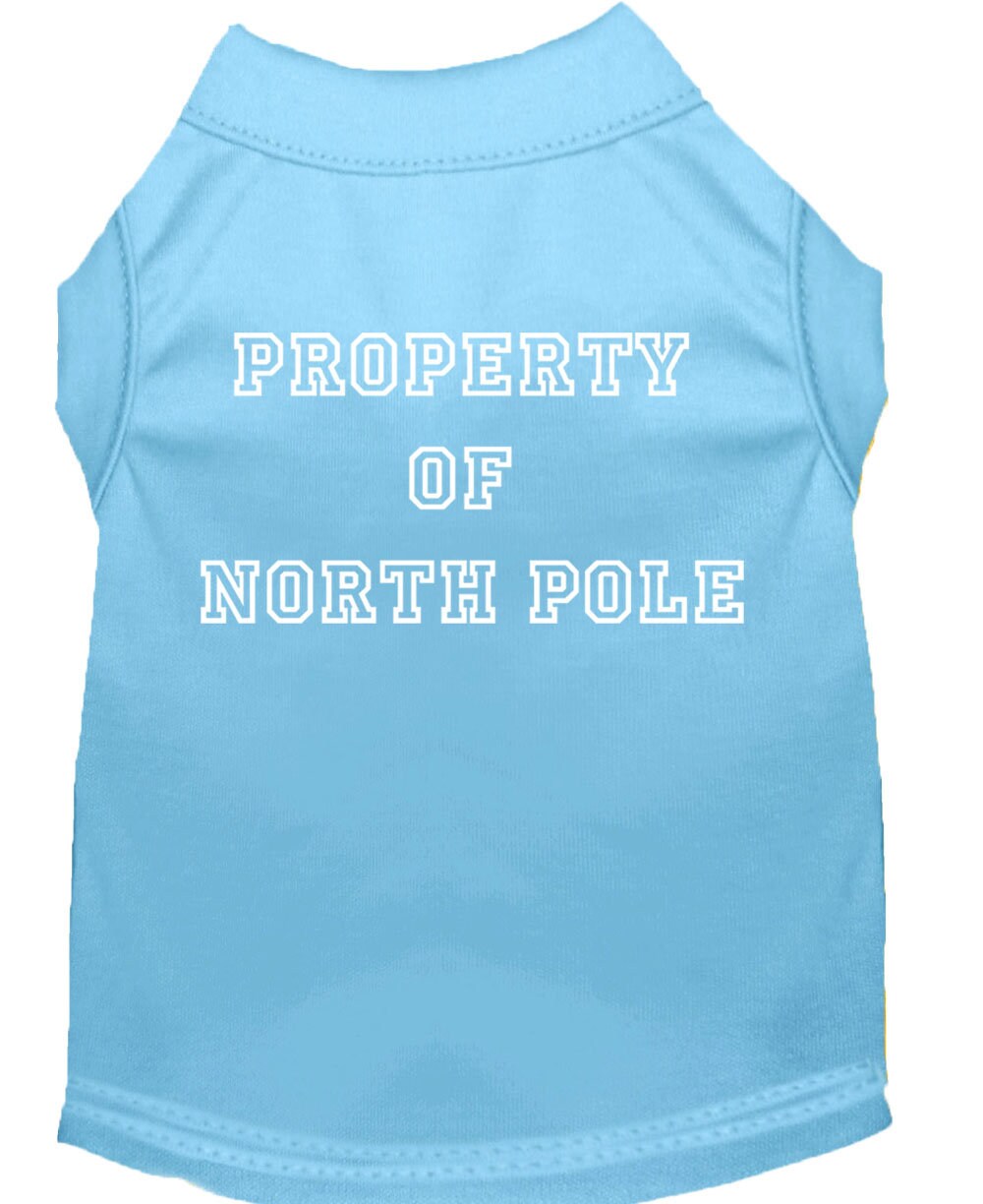 A festive Christmas dog shirt featuring the text 'Property Of North Pole', designed for comfort and durability, perfect for holiday celebrations.