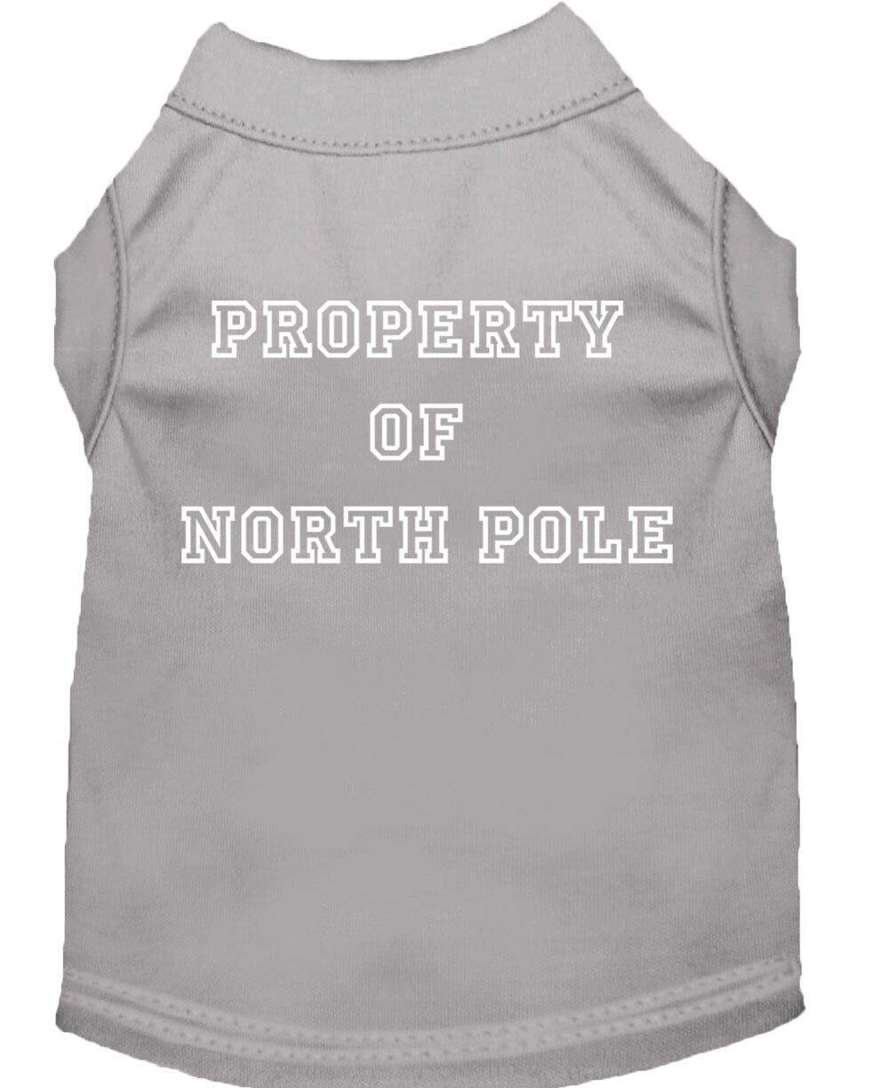 A festive Christmas dog shirt featuring the text 'Property Of North Pole', designed for comfort and durability, perfect for holiday celebrations.
