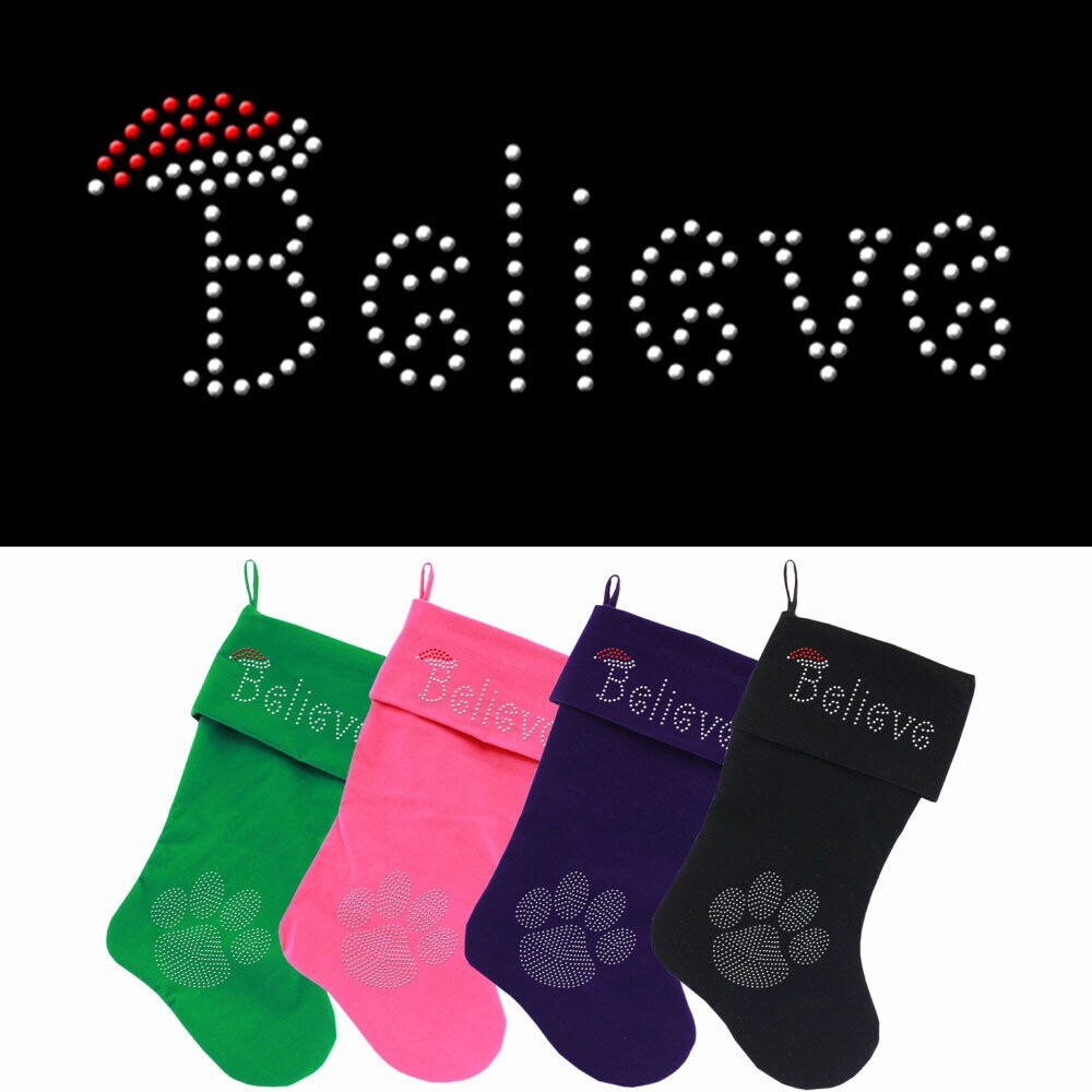 A luxurious 18-inch Christmas stocking made of soft velvet, featuring a sparkling rhinestone design that spells 'Believe', perfect for holiday decor.