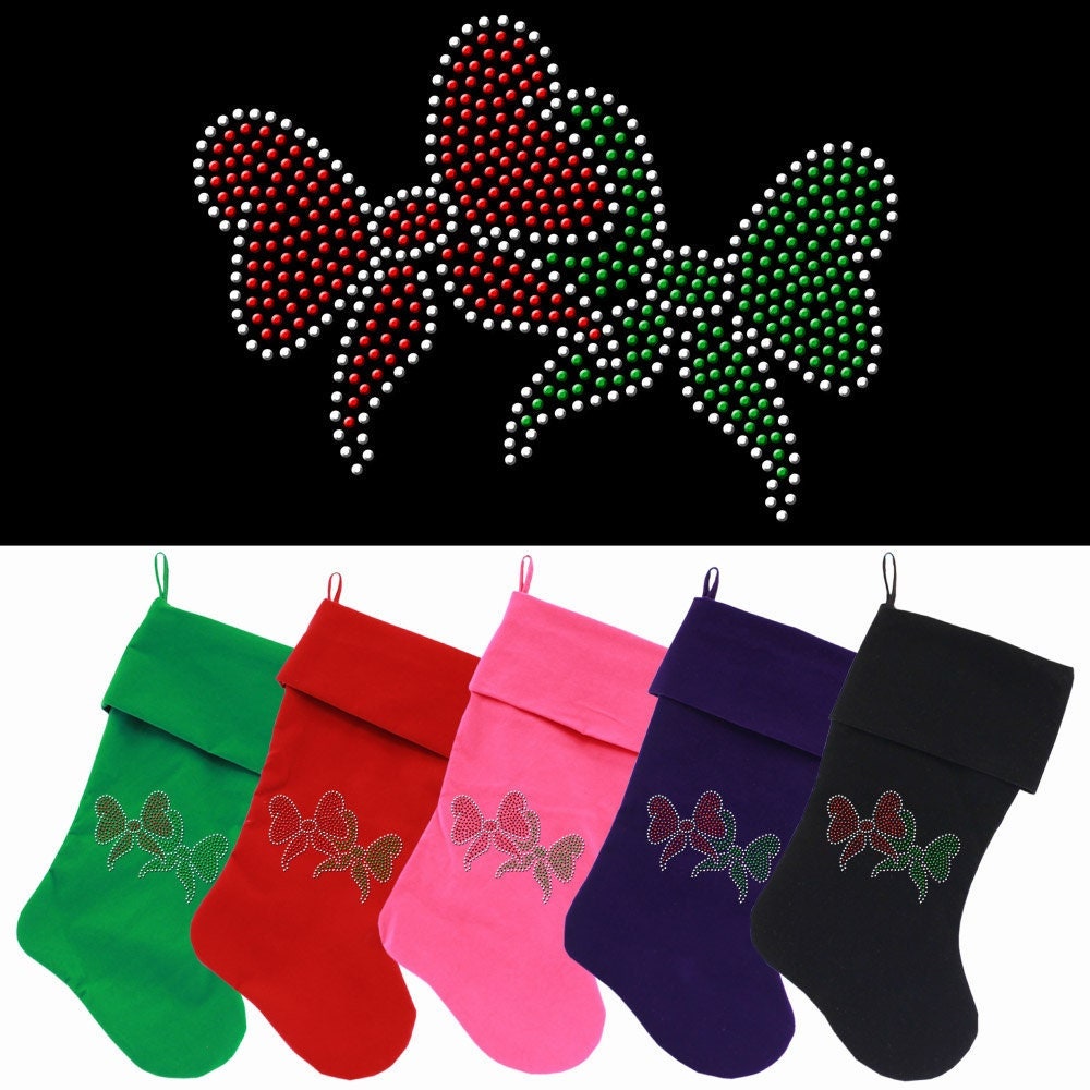 Luxurious 18-inch Christmas stocking made of soft velvet, featuring festive rhinestone bows for a glamorous holiday touch.