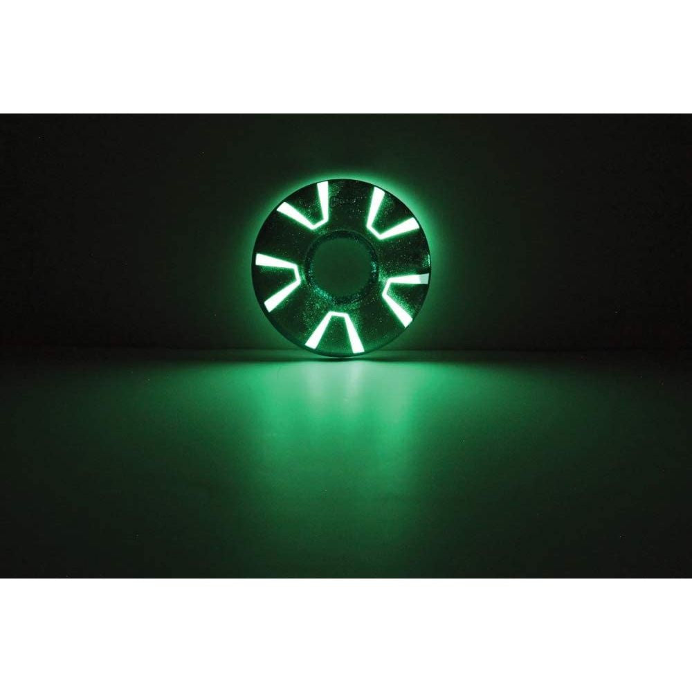 Chuckit! Zipflight Max Glow Dog Toy glowing in the dark, showcasing its bright colors and durable design.