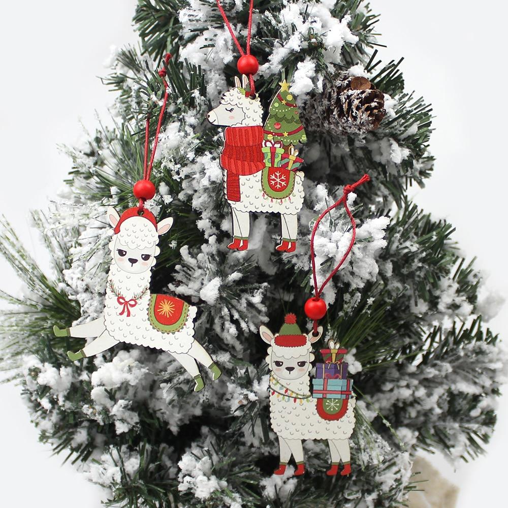 A set of three painted wooden alpaca Christmas ornaments, featuring vibrant colors and red hanging strings, perfect for holiday decorations.