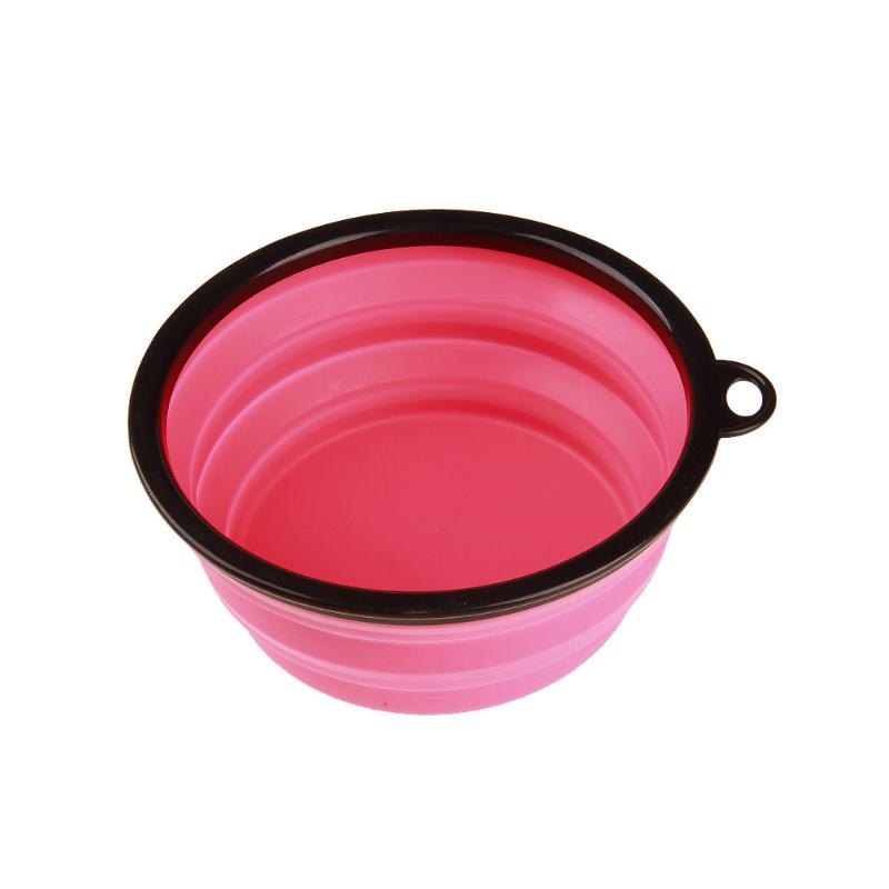 Collapsible Silicone Bowl for Dogs in vibrant colors, lightweight and portable with a carabiner attached.