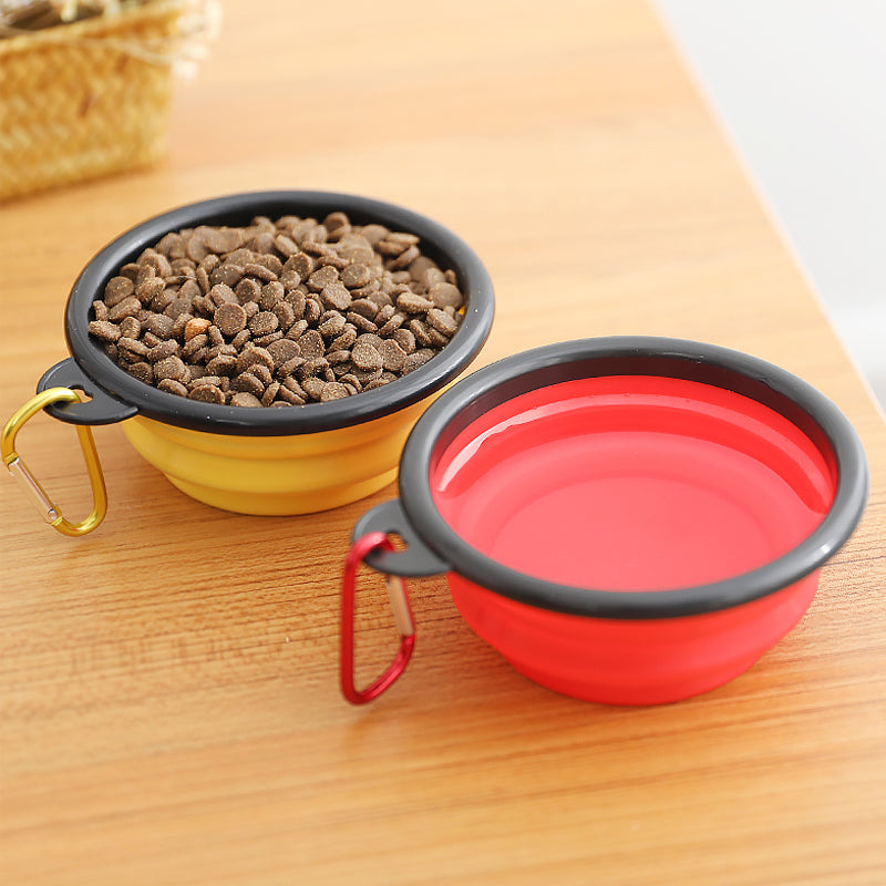 Collapsible Silicone Bowl for Dogs in vibrant colors, lightweight and portable with a carabiner attached.