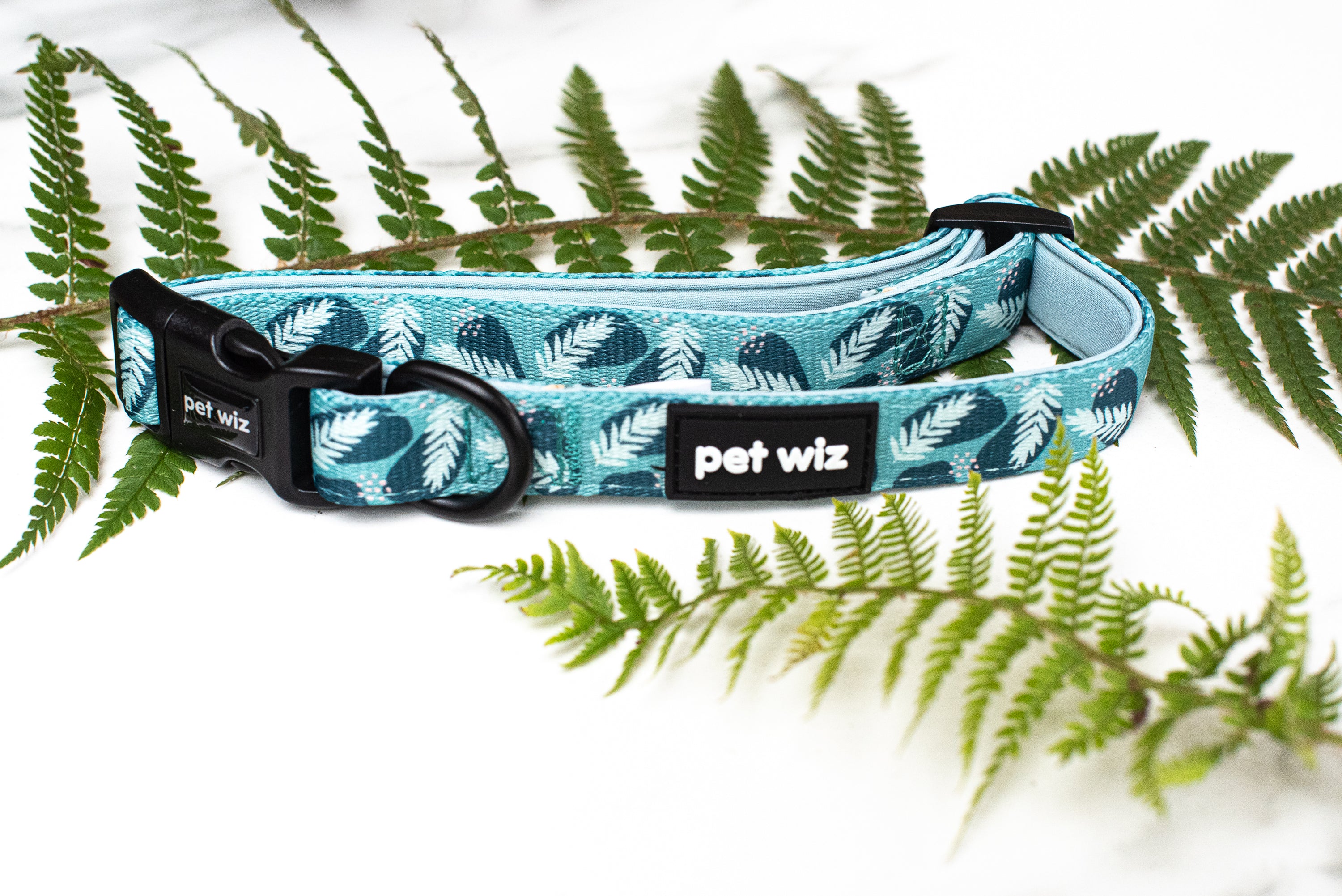 Stylish jungle-themed dog collar in three vibrant patterns, featuring adjustable strap and neoprene padding for comfort.