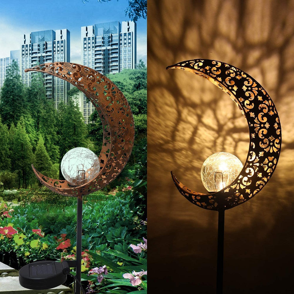 Crackle Glass Globe Metal Light illuminating a garden path, showcasing its beautiful design and warm white LED glow.