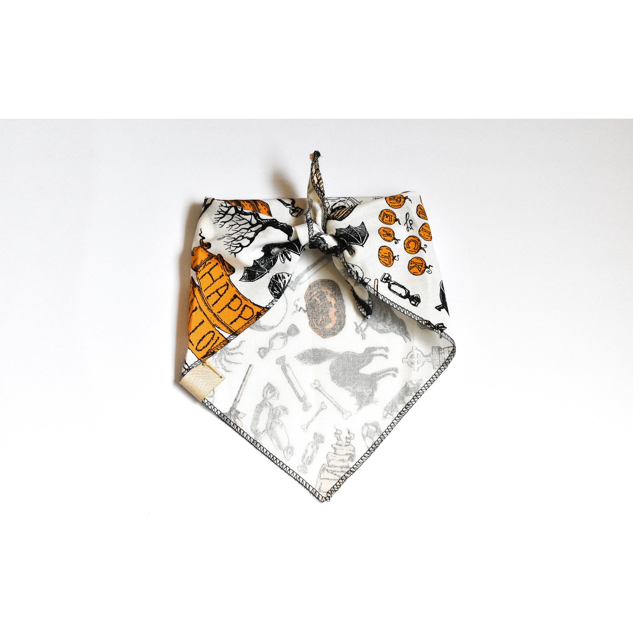 Creep it Real dog bandana featuring Halloween-themed cotton fabric and a vegan leather tag, perfect for stylish pets.