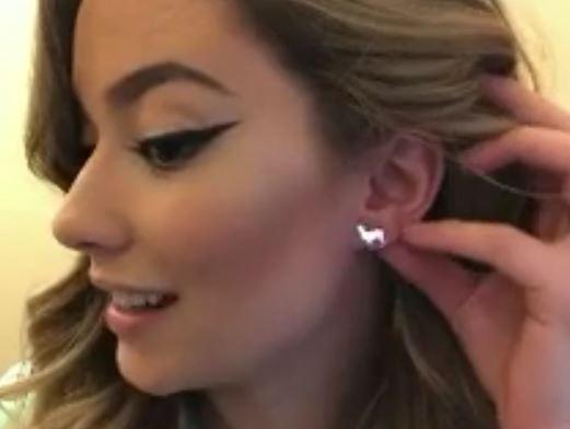 Cute silver alpaca earrings with a stylish design, handmade from 95% pure silver, displayed in a velvet jewelry pouch.