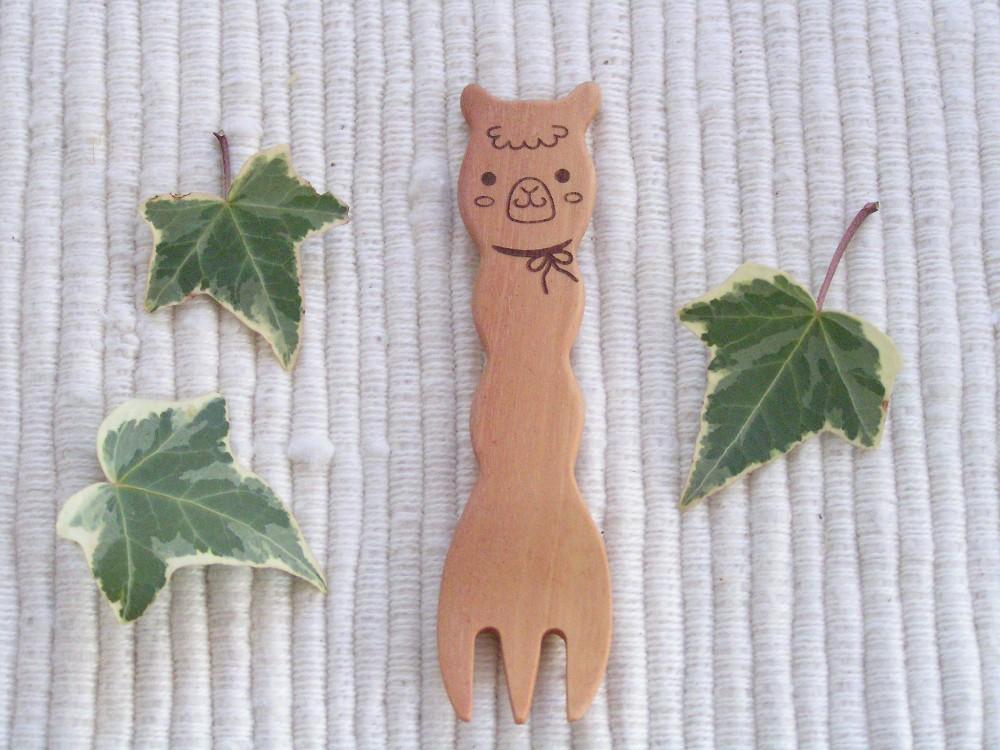 Cute wooden snack fork designed like an alpaca, perfect for kids and adults, made from natural maple wood with a matte finish.