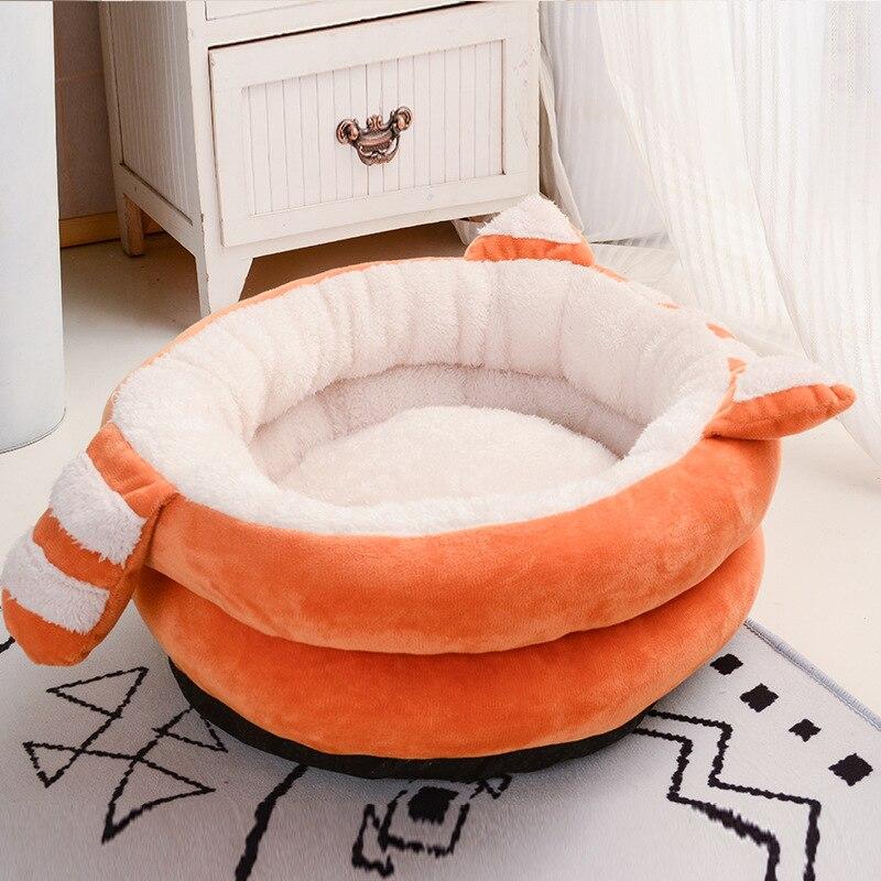 A cozy Cute Cat Bed House made of soft fleece and PP cotton, designed for cats and dogs, featuring a warm and inviting sleeping space.