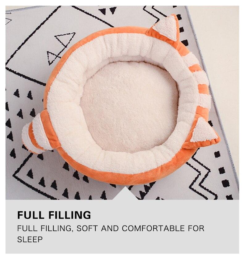 A cozy Cute Cat Bed House made of soft fleece and PP cotton, designed for cats and dogs, featuring a warm and inviting sleeping space.