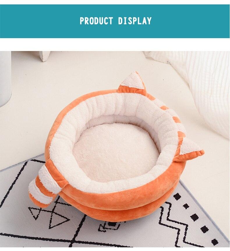A cozy Cute Cat Bed House made of soft fleece and PP cotton, designed for cats and dogs, featuring a warm and inviting sleeping space.