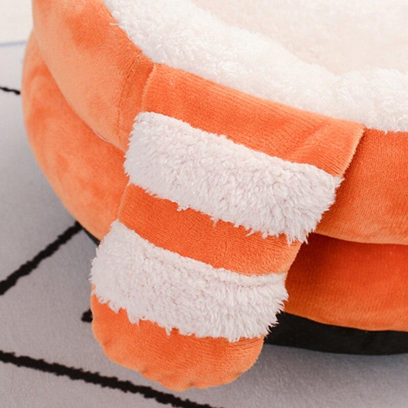 A cozy Cute Cat Bed House made of soft fleece and PP cotton, designed for cats and dogs, featuring a warm and inviting sleeping space.