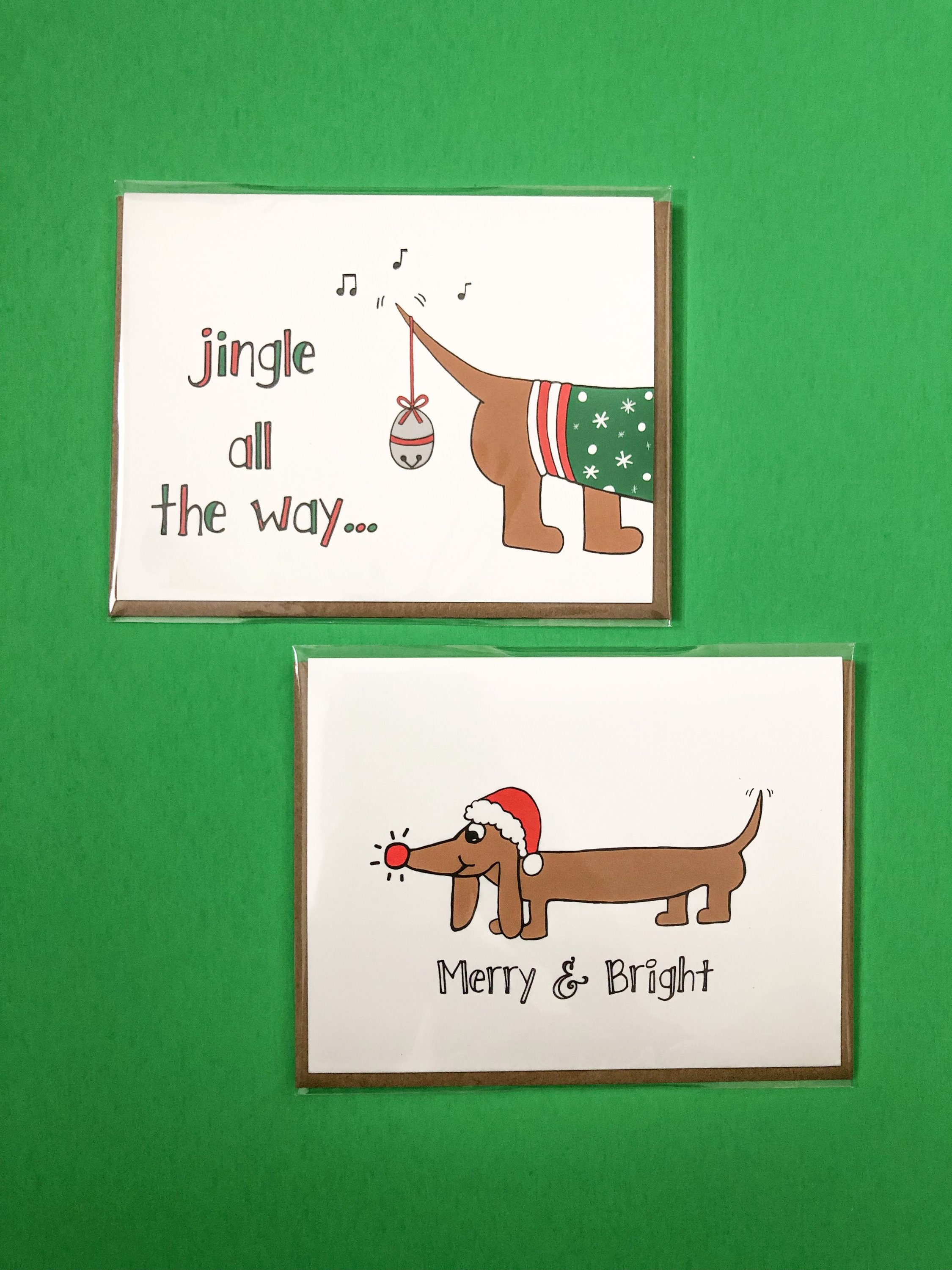 Dachshund Christmas Card featuring a dog in a Santa hat with festive text.