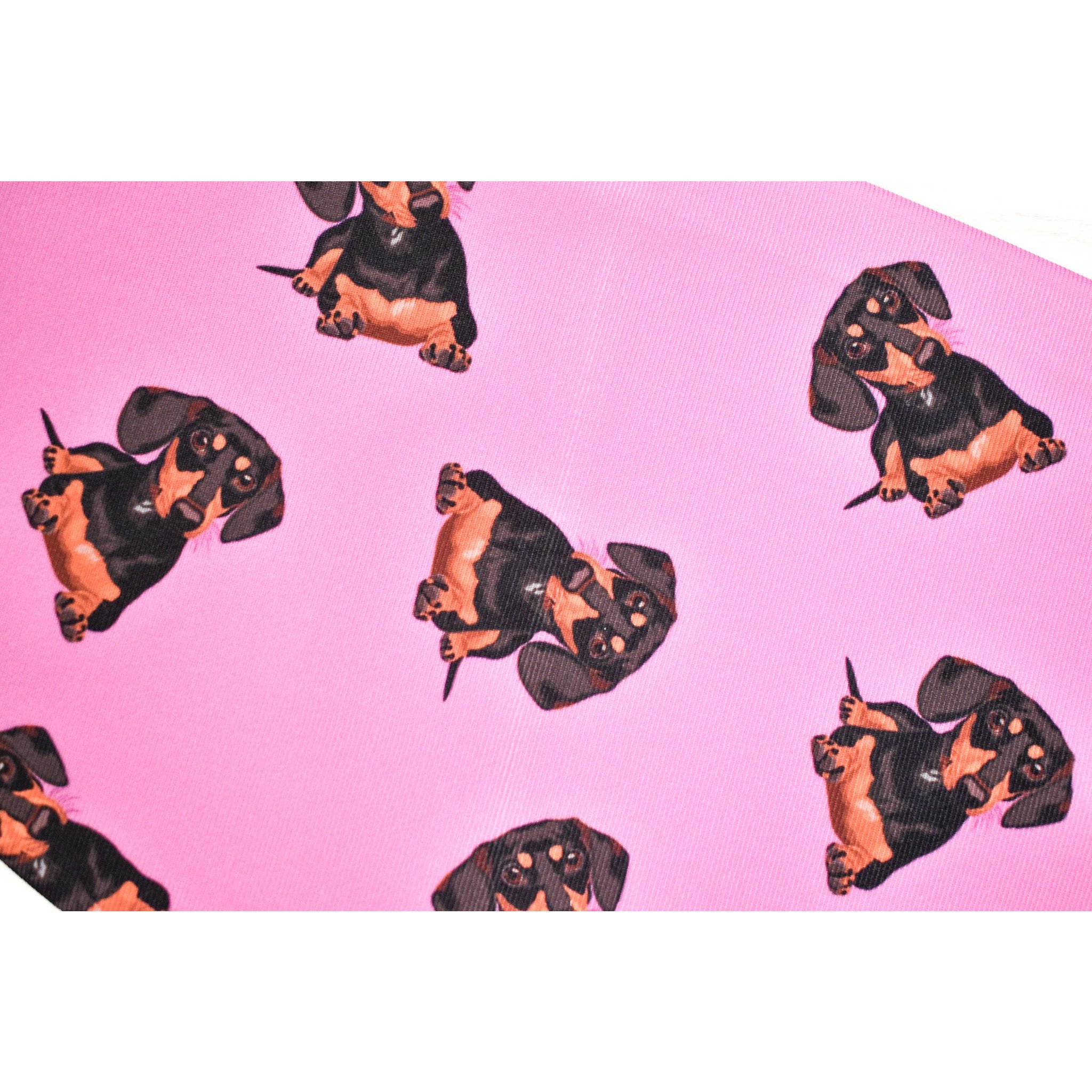 A stylish black and tan dachshund face cover, handmade with breathable fabric, showcasing a cute dog print.