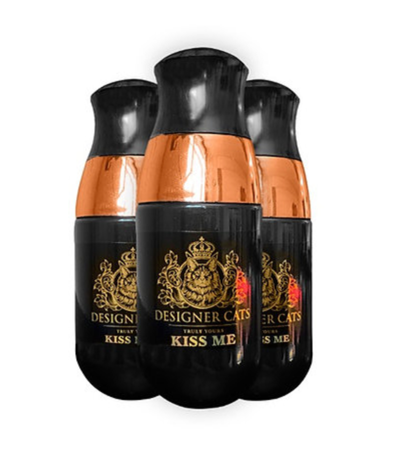 A bottle of Designer Cats Perfume - Kiss Me, featuring a sleek design and a refreshing scent for cats.