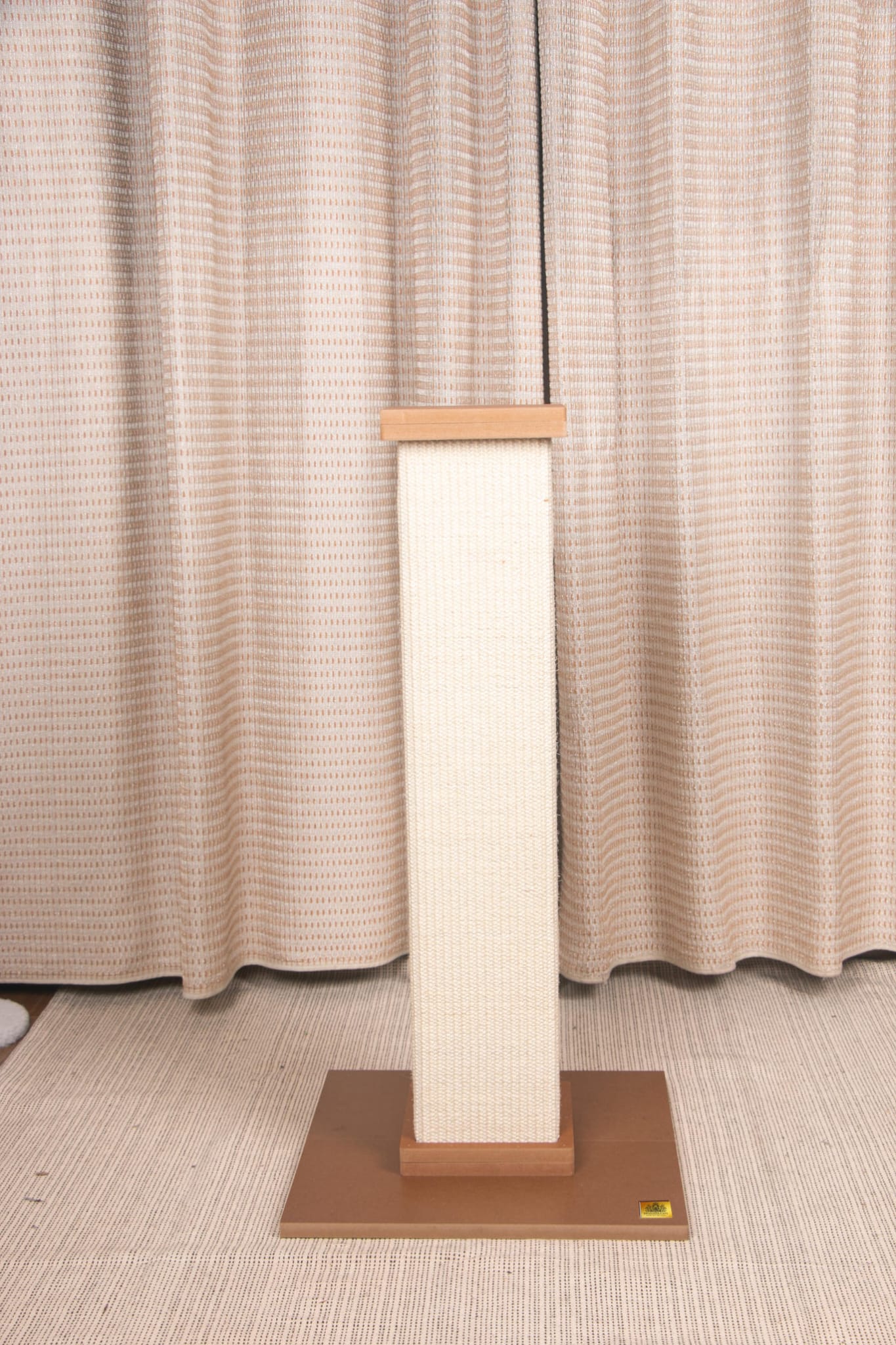 Designer Cats Scratching Post in brown and white, featuring a sturdy wooden base and sisal-wrapped scratching area, perfect for feline play.