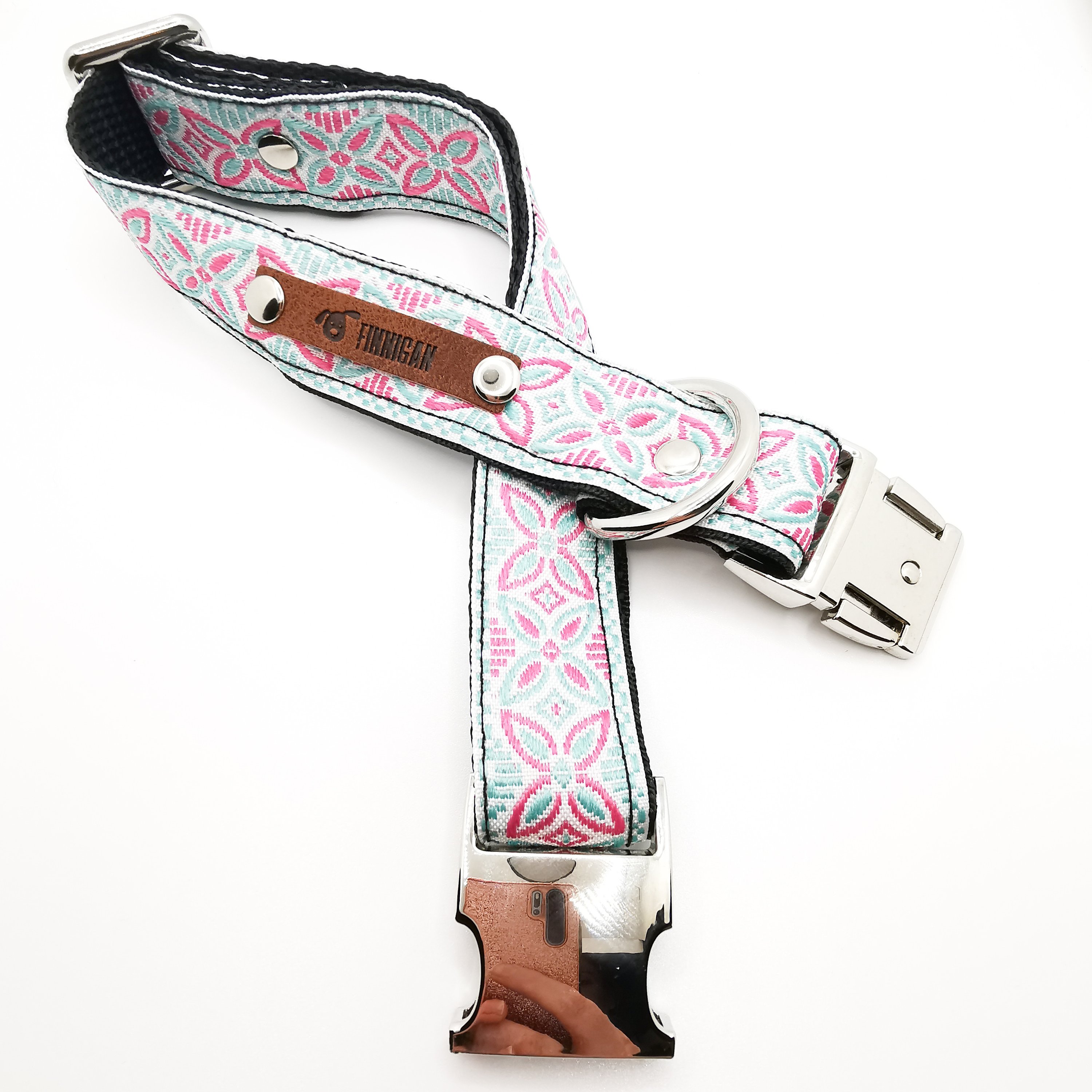 A stylish designer dog collar featuring unique fabrics, adjustable size, and a personalised aluminium buckle.