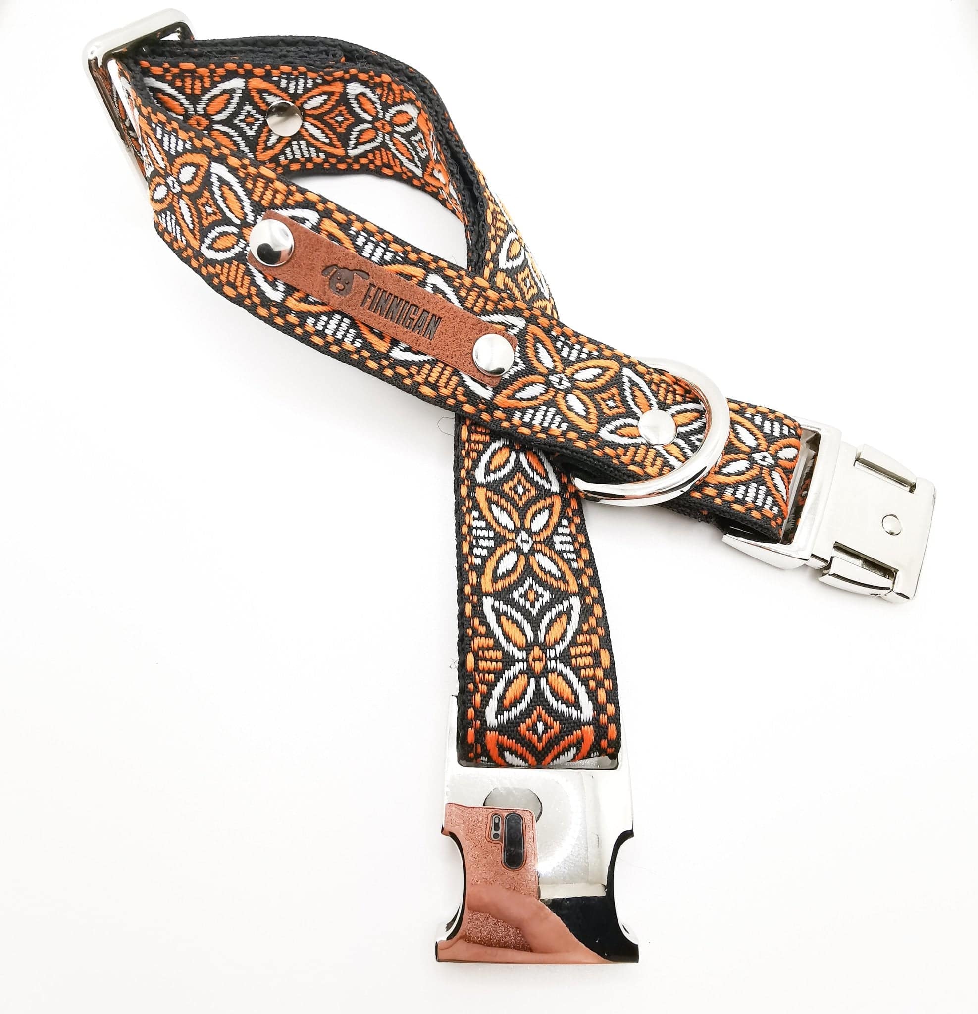 A stylish designer dog collar featuring unique fabrics, adjustable size, and a personalised aluminium buckle.