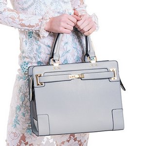 Designer grey vegan leather pet carrier with mesh windows and removable lining, suitable for small dogs and cats.