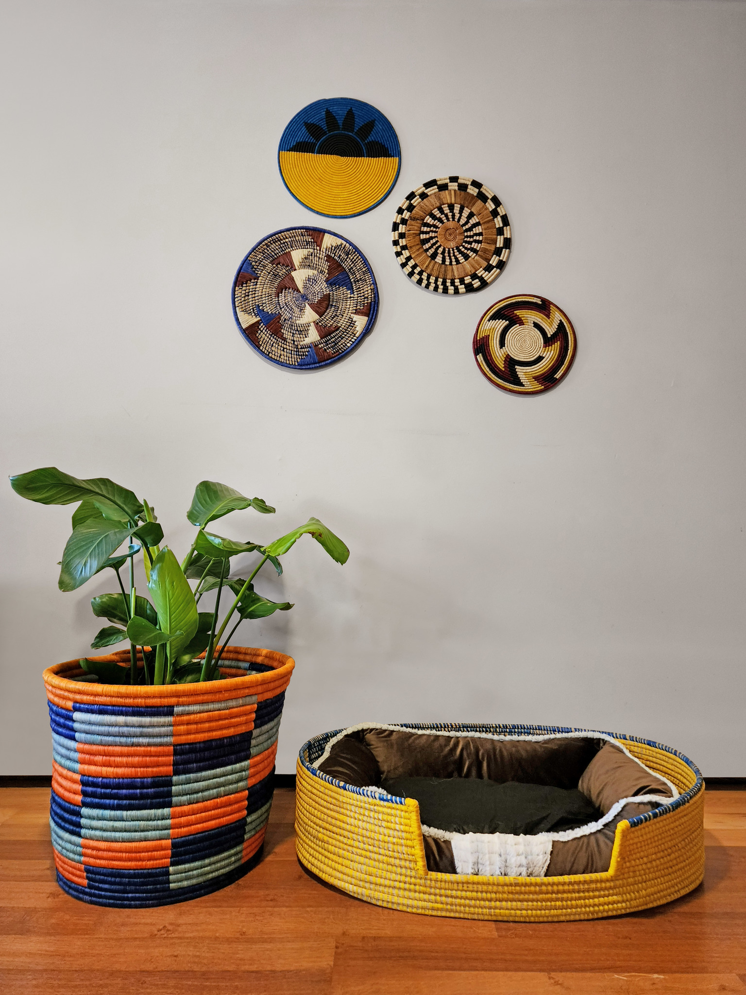 Dhahabu Handcrafted Eco-Friendly Pet Bed made from natural materials, showcasing vibrant colors and intricate weaving by skilled artisans.