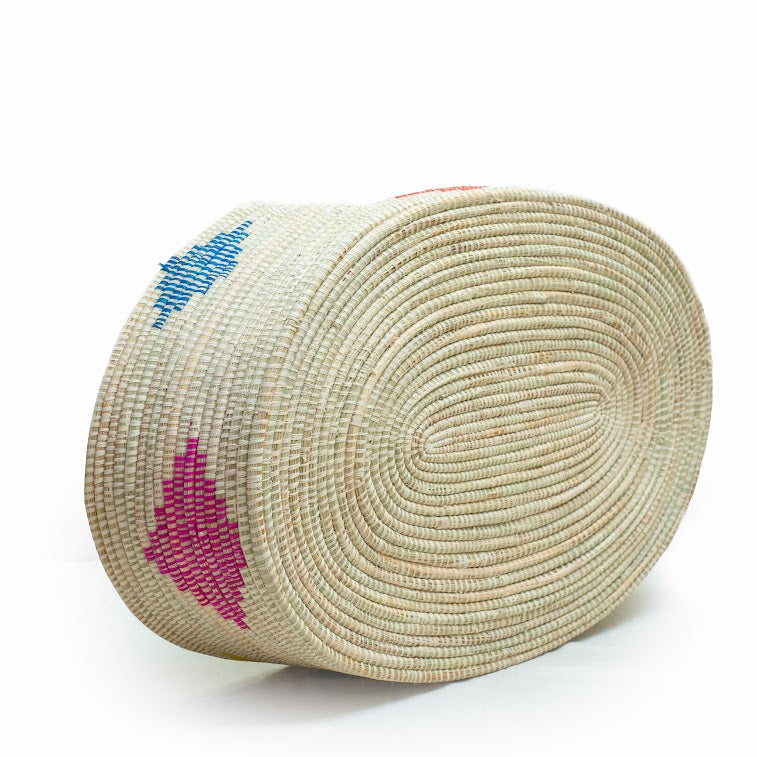 Dhahabu Handcrafted Eco-Friendly Pet Bed made from natural materials, showcasing vibrant colors and intricate weaving by skilled artisans.