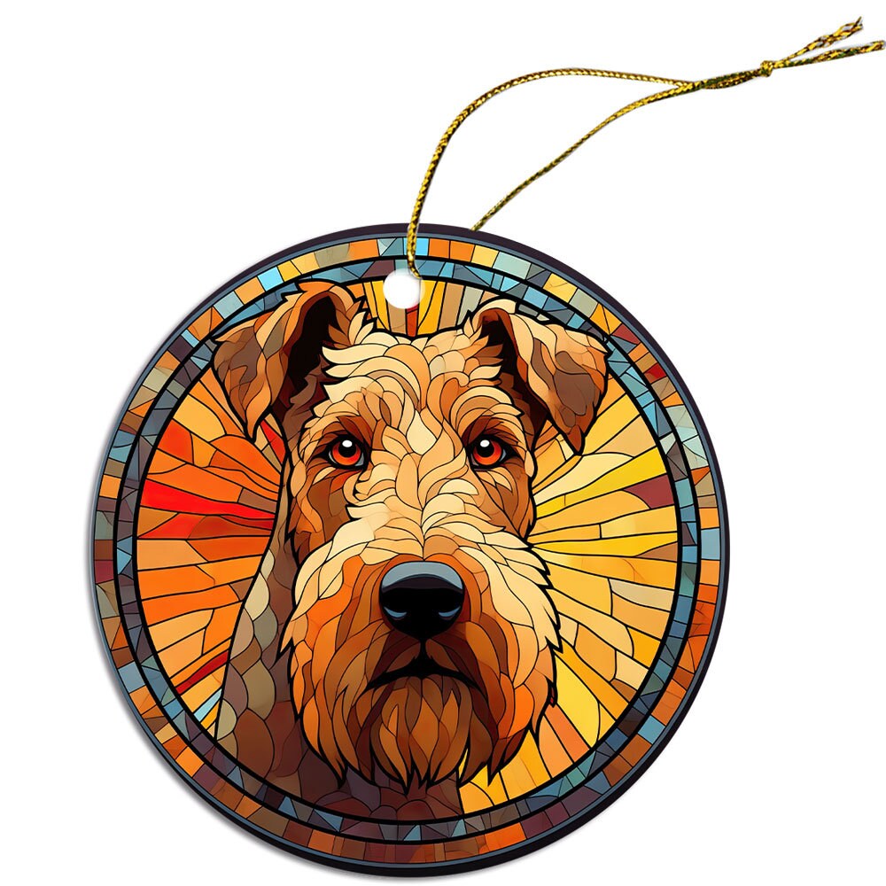 A beautiful stained glass style Christmas ornament featuring an Airedale Terrier, showcasing vibrant colors and intricate design.