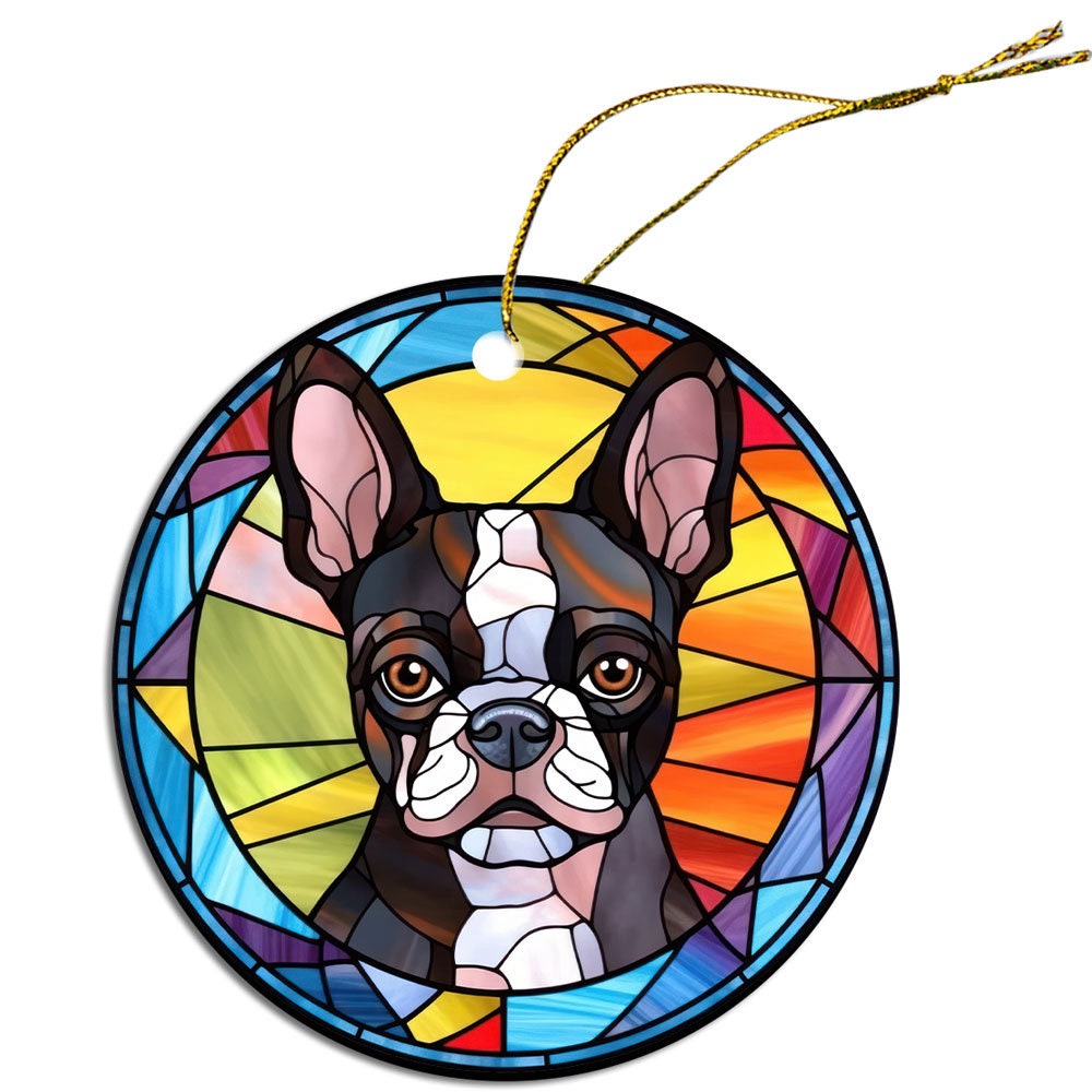 Stained glass style Christmas ornament featuring a Boston Terrier, elegantly designed with vibrant colors and a golden hanging string.