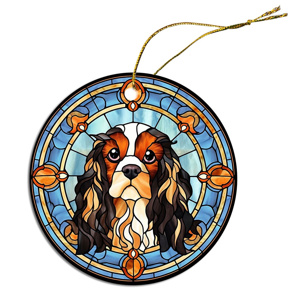 Cavalier King Charles Spaniel stained glass style Christmas ornament, featuring a round ceramic design with a golden string.
