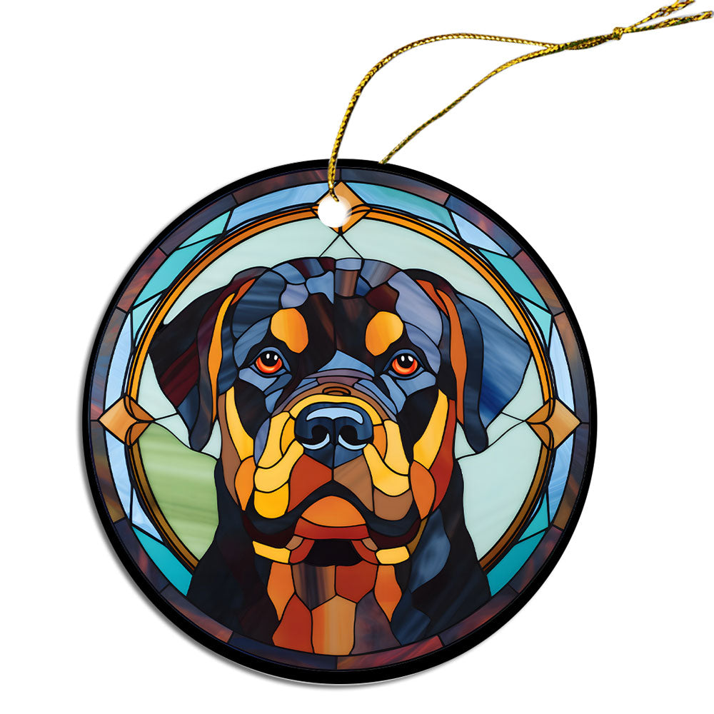 Stained glass style Christmas ornament featuring a Rottweiler breed design, elegantly hung with a golden string.