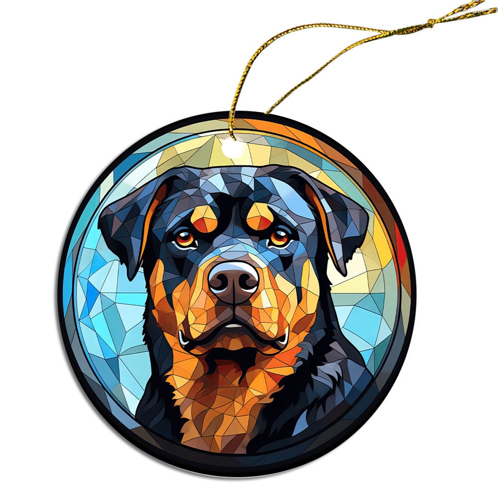 Stained glass style Christmas ornament featuring a Rottweiler breed design, elegantly hung with a golden string.