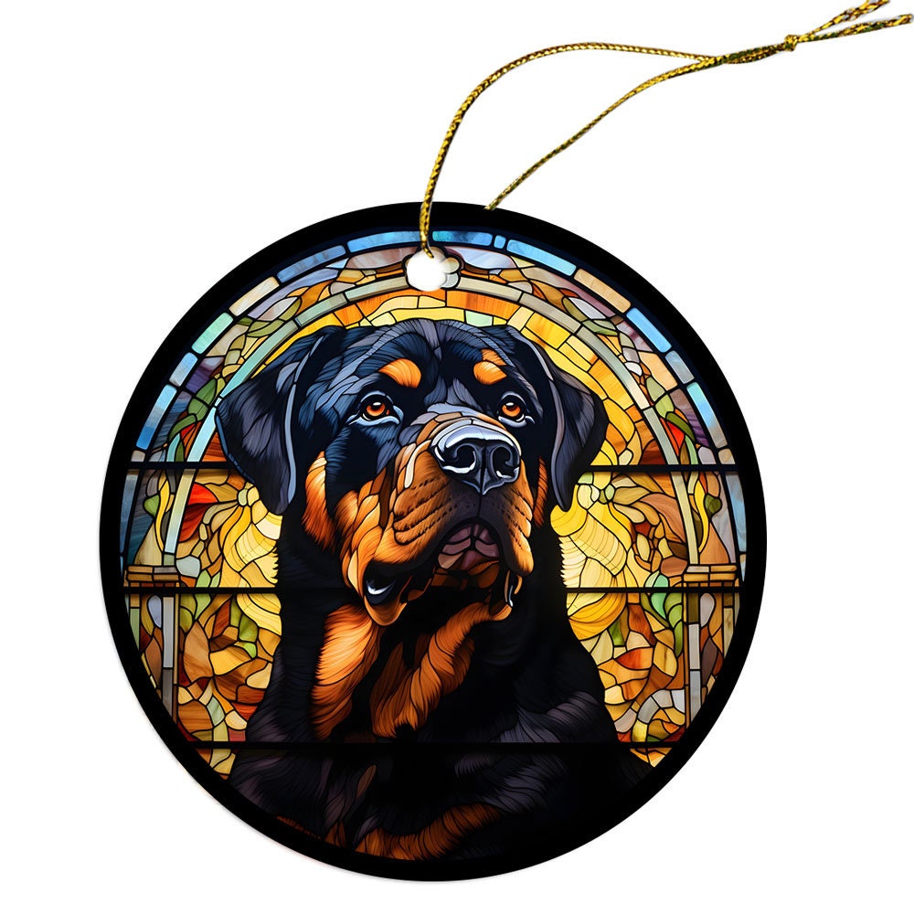 Stained glass style Christmas ornament featuring a Rottweiler breed design, elegantly hung with a golden string.