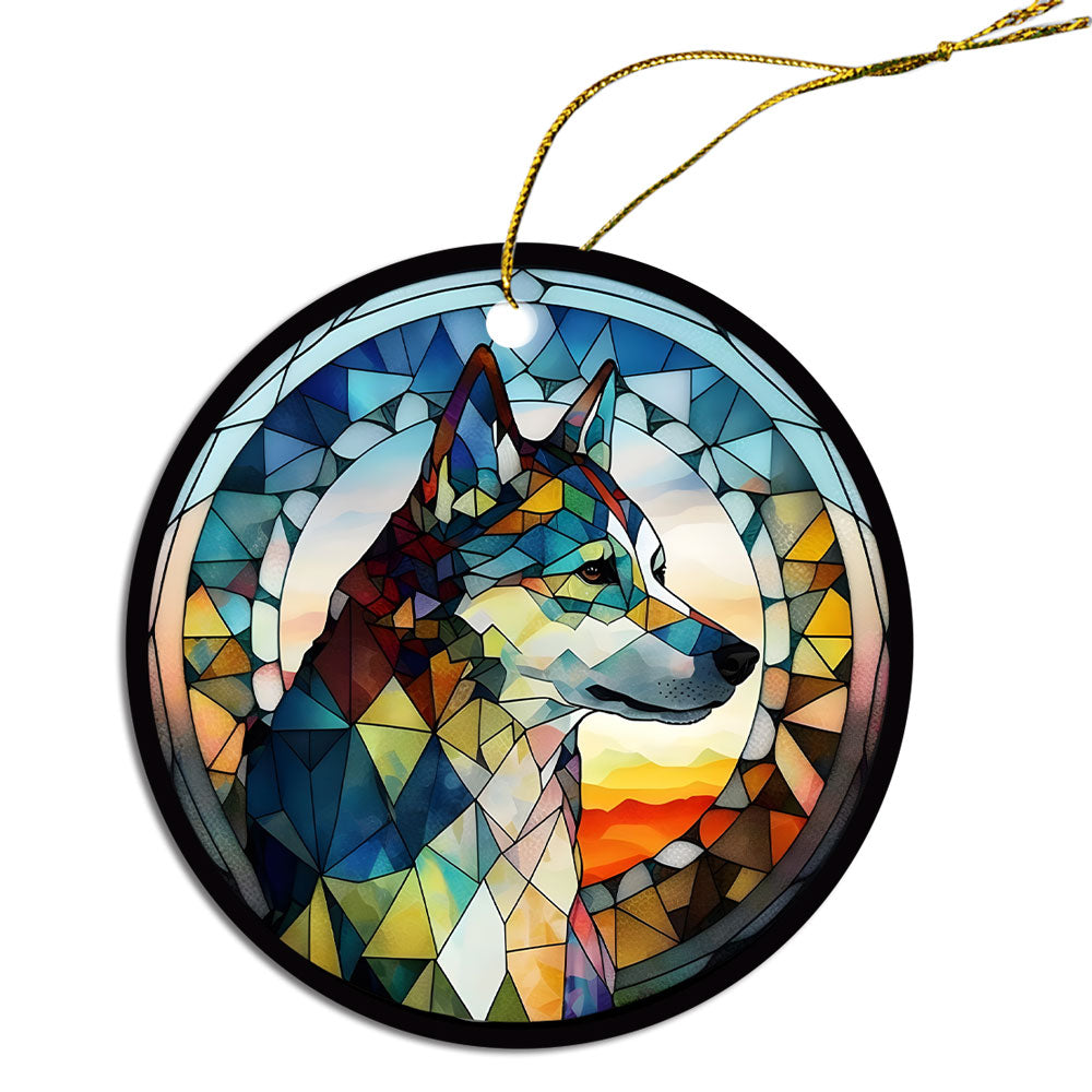 Siberian Husky stained glass style Christmas ornament, featuring a round ceramic design with vibrant colors and an elegant golden string.