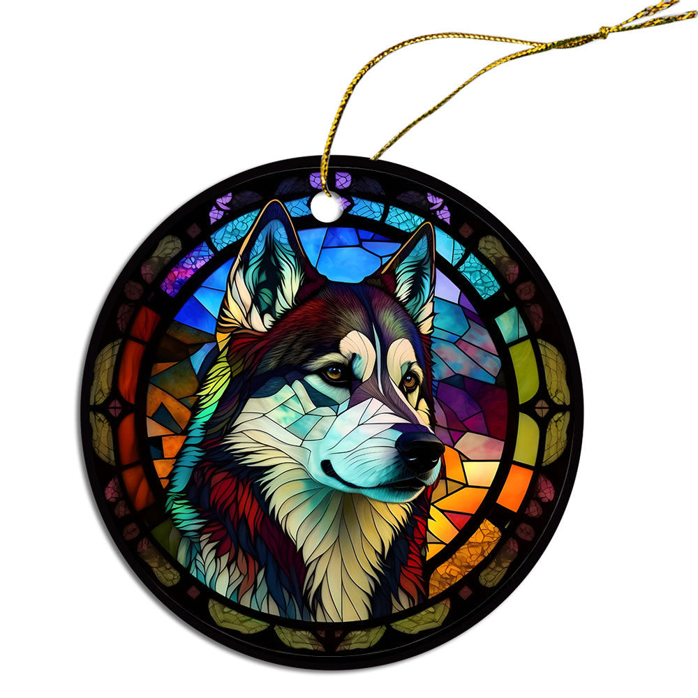 Siberian Husky stained glass style Christmas ornament, featuring a round ceramic design with vibrant colors and an elegant golden string.