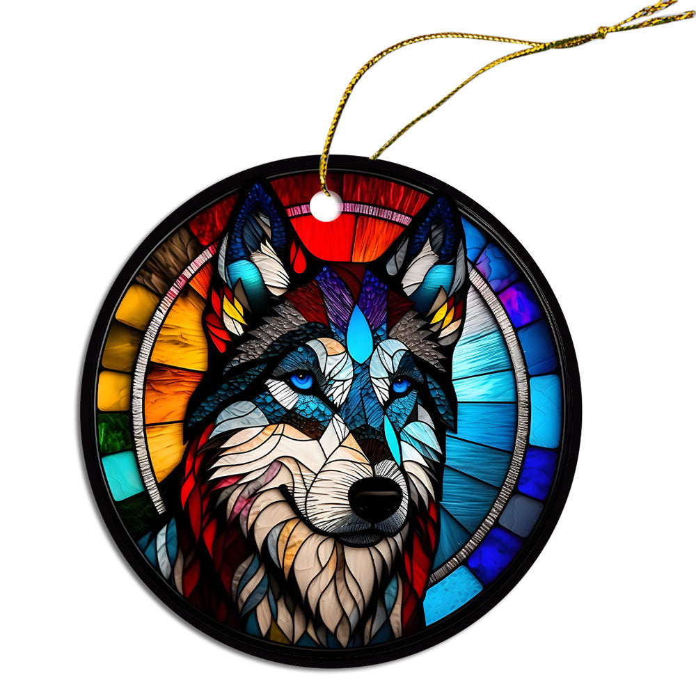 Siberian Husky stained glass style Christmas ornament, featuring a round ceramic design with vibrant colors and an elegant golden string.