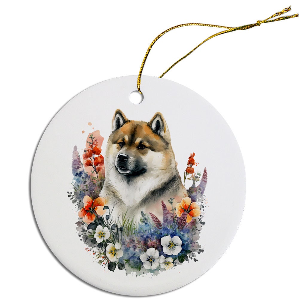 Ceramic round Christmas ornament featuring an Akita dog design with a golden string for hanging.