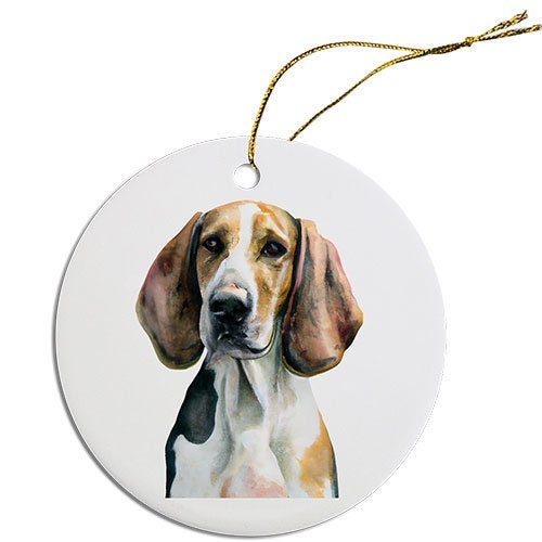 Ceramic round Christmas ornament featuring an American Foxhound design with a golden string.
