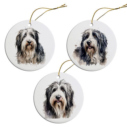 Ceramic round Christmas ornament featuring a Bearded Collie design with a golden string for hanging.