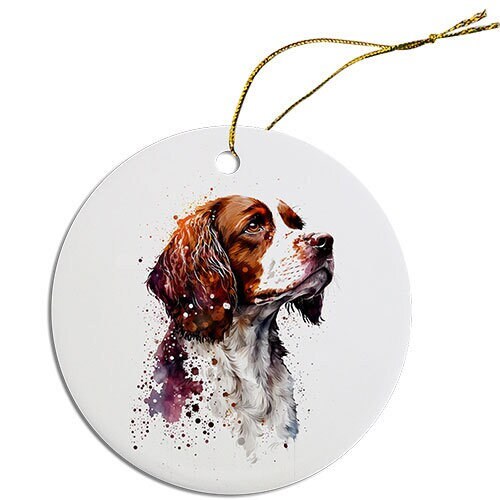 Ceramic round Christmas ornament featuring a Brittany dog design with a golden string.