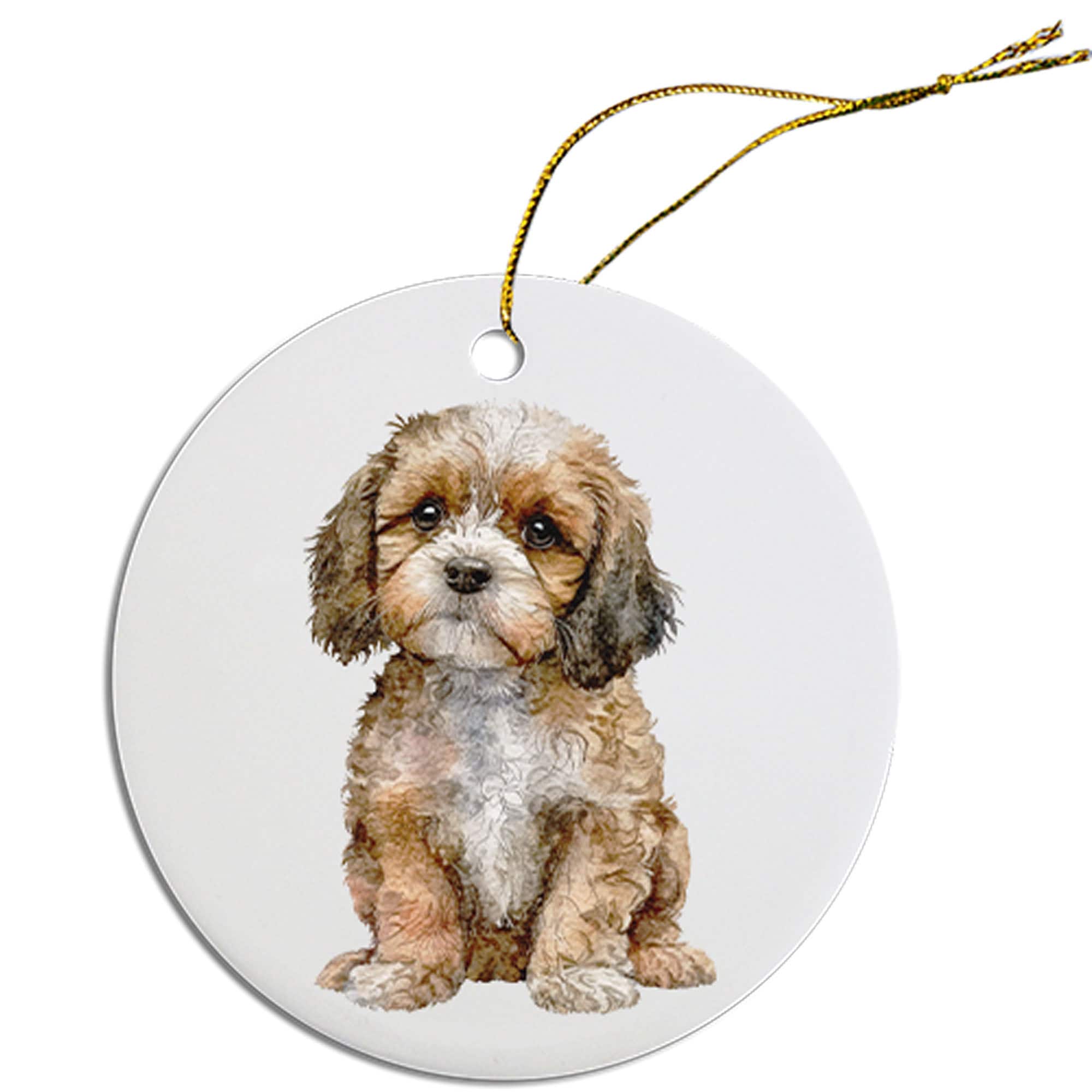 Ceramic round Christmas ornament featuring a Cavapoo design with a golden string for hanging.