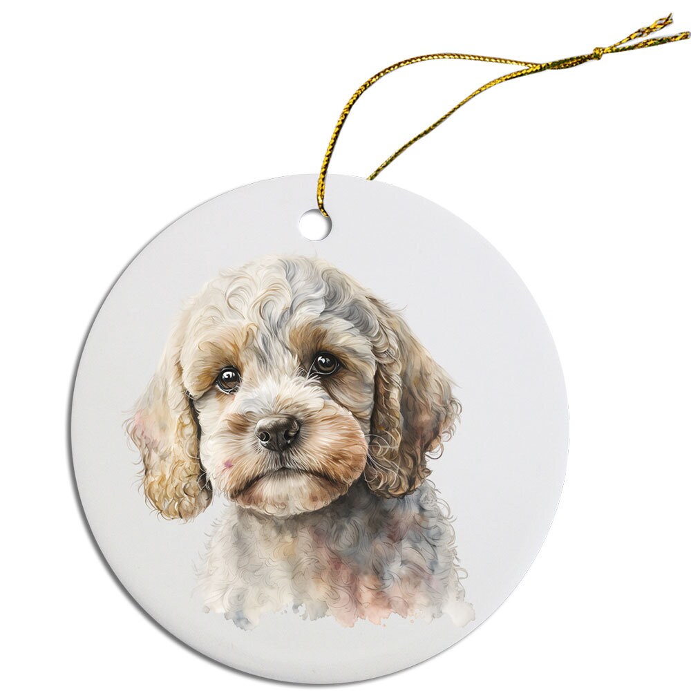 Ceramic round Christmas ornament featuring a Cockapoo design with a golden string for hanging.